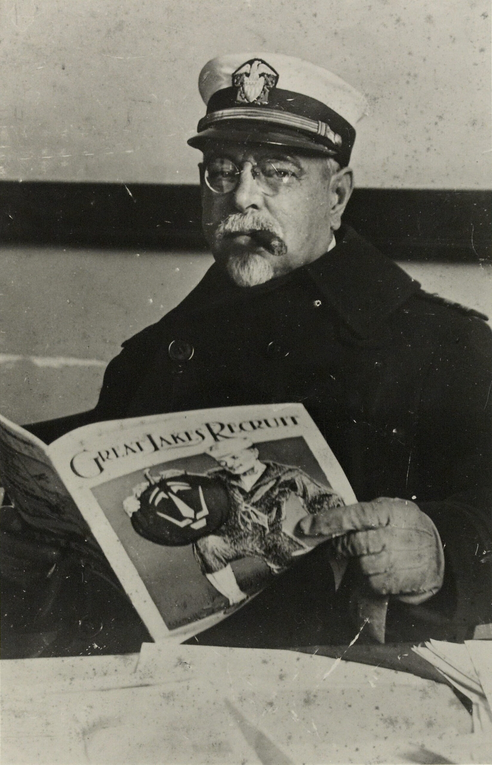 Formal portrait photograph of John Philip Sousa in U.S. Navy Reserve uniform during World War I, c. 1917, wearing a peaked officer's cap with insignia and a dark Navy jacket